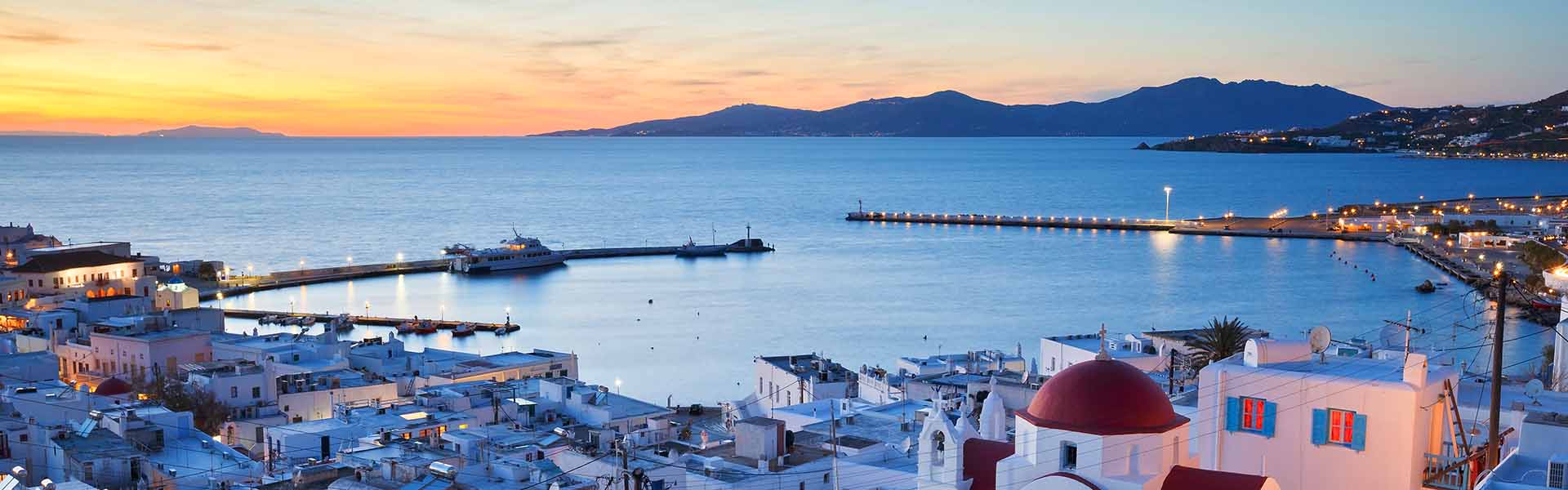 View of Mykonos town and Tinos island in the distance, Greece.
